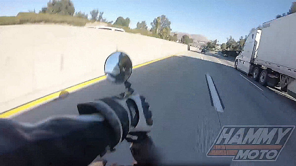 world s luckiest rider crashes and slides right under a trailer fast