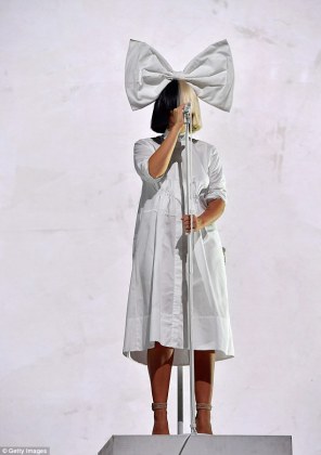 sia wears a tiered ruffle dress as she performs at boston calling medium