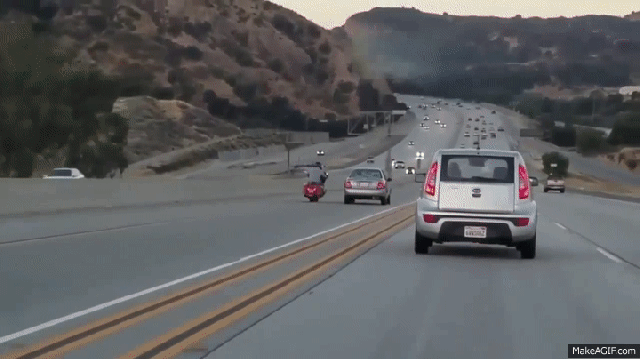 motorcyclist kicks car resulting in multi vehicle collision medium