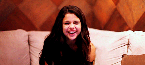 selena gomez laughing gif find share on giphy medium