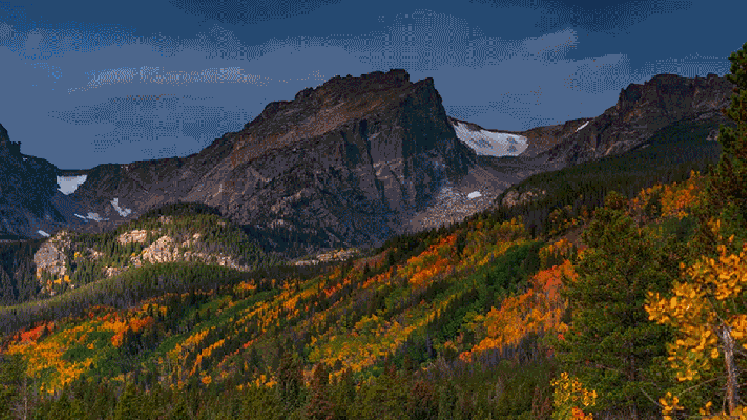 the rocky mountains painted with the colors of fall are a treat for medium