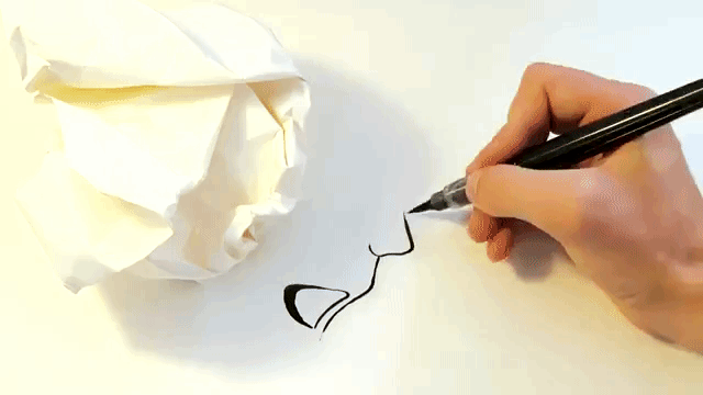 london artist draws strange faces using the shadow of a crumpled up medium