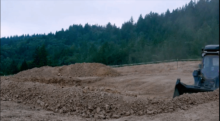 watch this autonomous bulldozer excavate dirt without a human medium