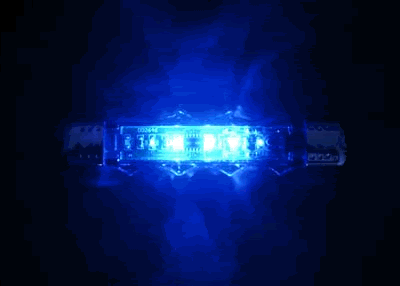 a flashing blue light mounted on a motor vehicle indicates medium