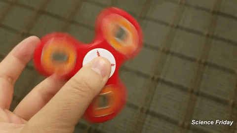 fidget spinner gif by science friday find share on giphy medium