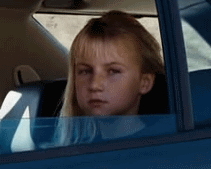 young girl flipping the bird in the car medium