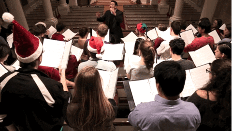 christmas carol singing gif by harvard university find share on medium