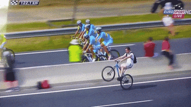 this guy popping an epic wheelie wins our hearts at the tour de medium