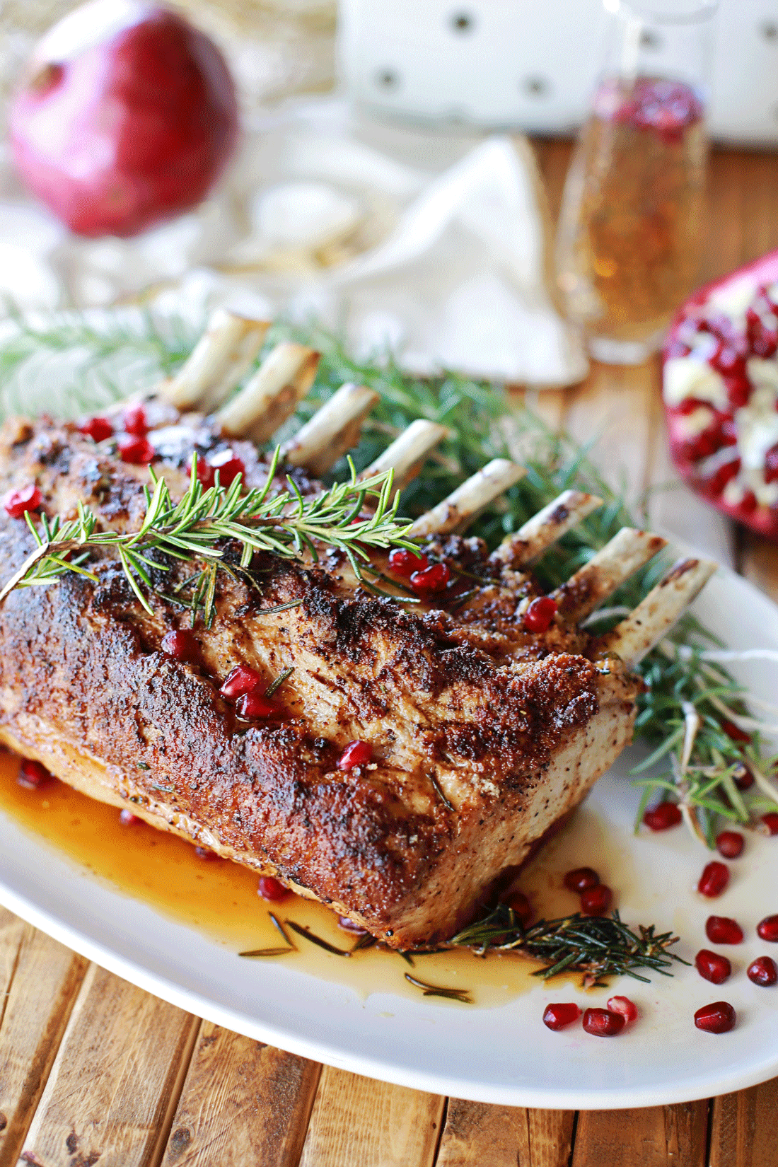 rosemary roasted rack of pork with pomegranate au jus tangled with small
