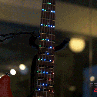 led lights on a fretboard seem like the obvious way to learn guitar small