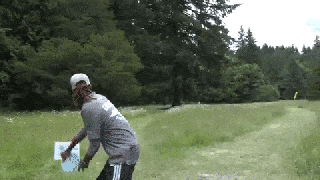 disc golfer throws frisbee 850 feet into hole small