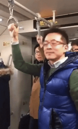 guy uses toilet plunger as a handle on the subway in china stupid small