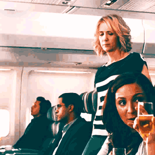 kristen wiig airplane gif find share on giphy
